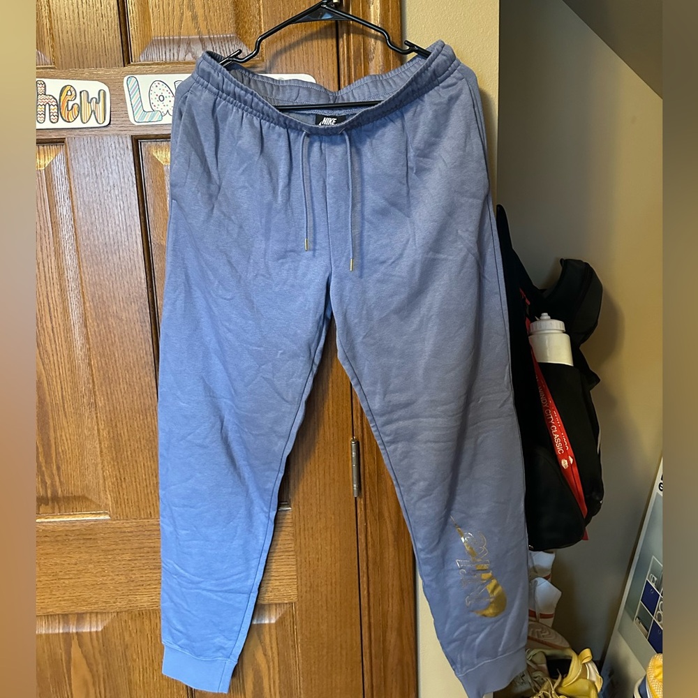 Nike women’s purple joggers with gold design MEDIUM